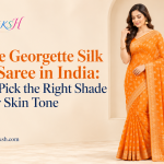 Woman wearing an orange georgette silk print saree
