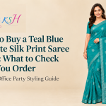 Teal blue georgette silk print saree draped for a festive occasion